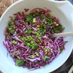 Colorful vegetable salad in large white bowl