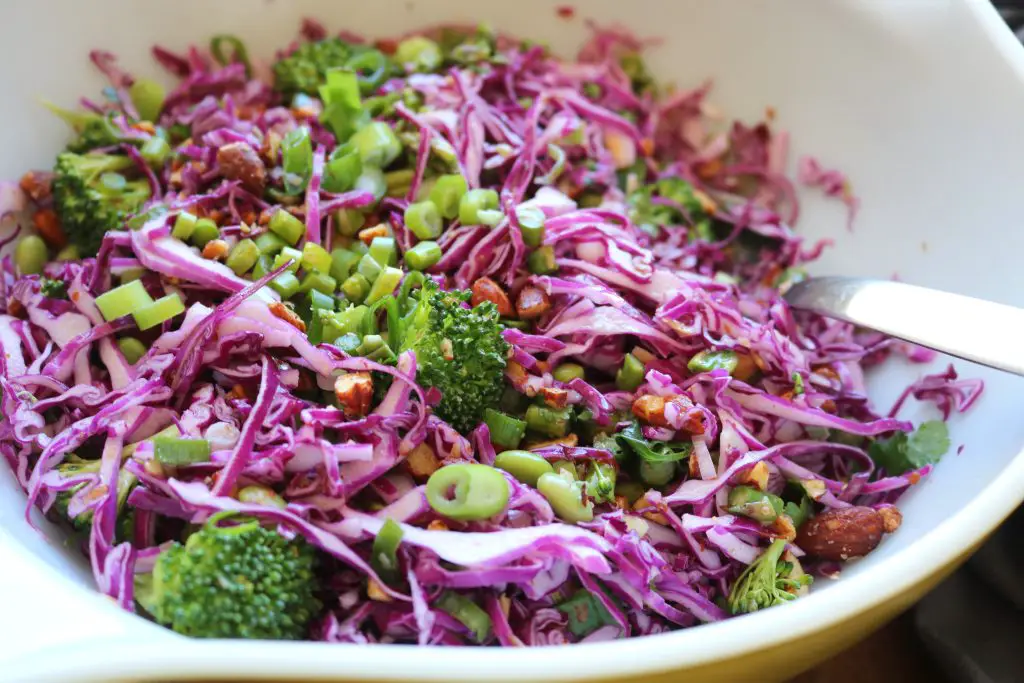 Colorful vegetable salad in large white bowl